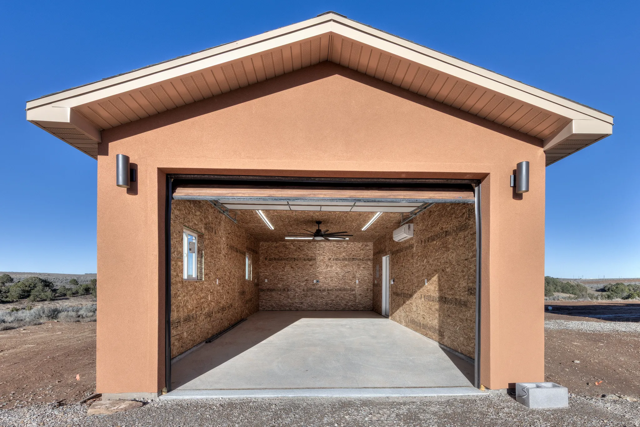 Garage featuring ceiling fan