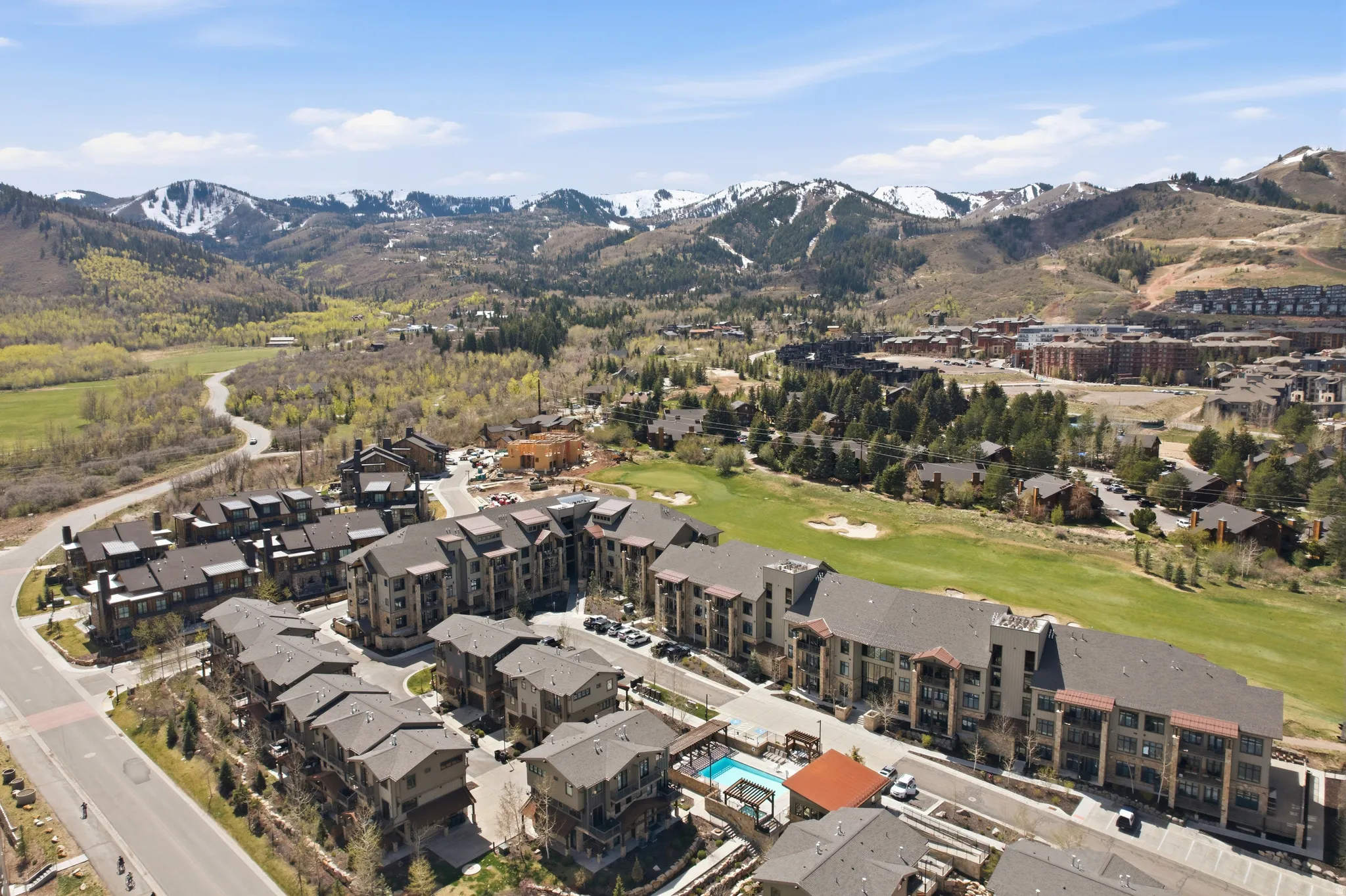 Expansive mountain landscape with snow-capped peaks