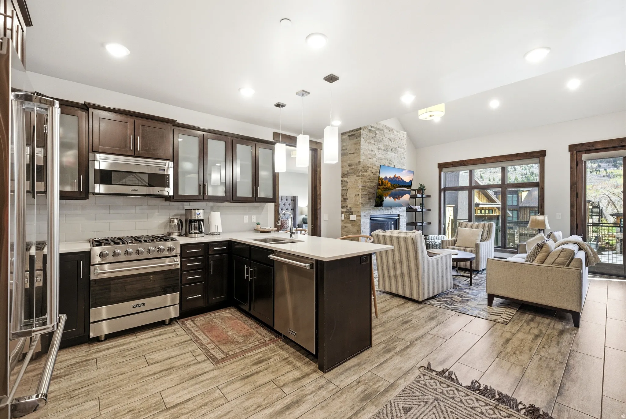 Open-concept living space with wood-finish flooring throughout
