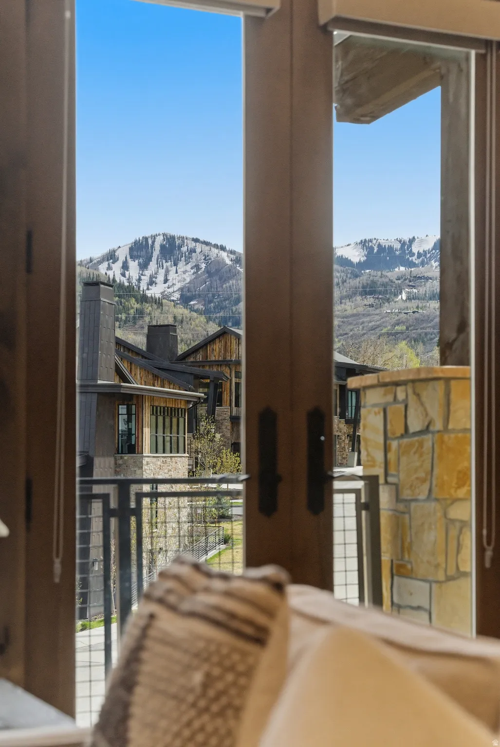 Mountain scenery framed by double doors