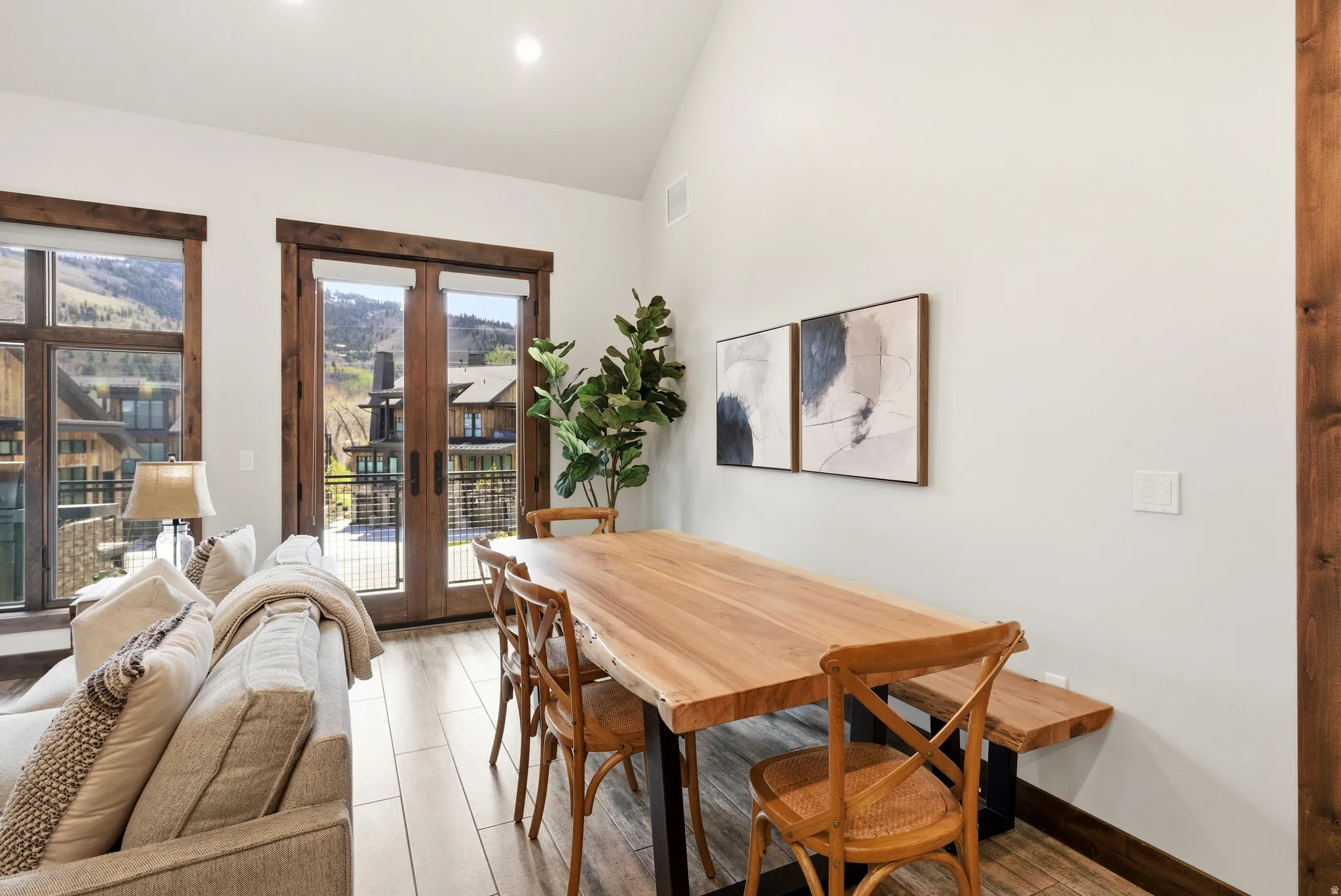 Bright dining area featuring a wood-finish dining table and light-colored walls