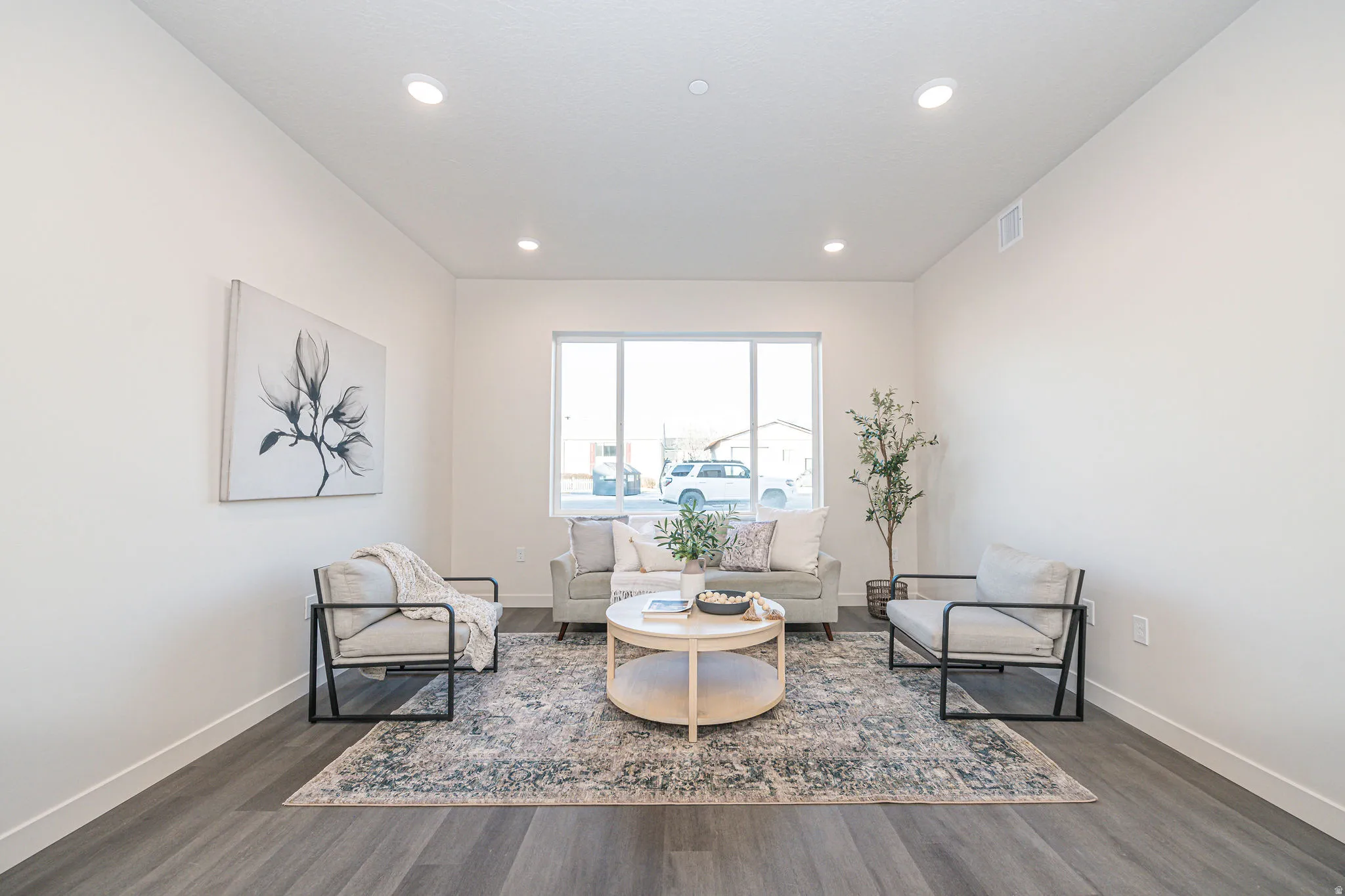 Sitting room featuring dark wood-type flooring and recessed lighting