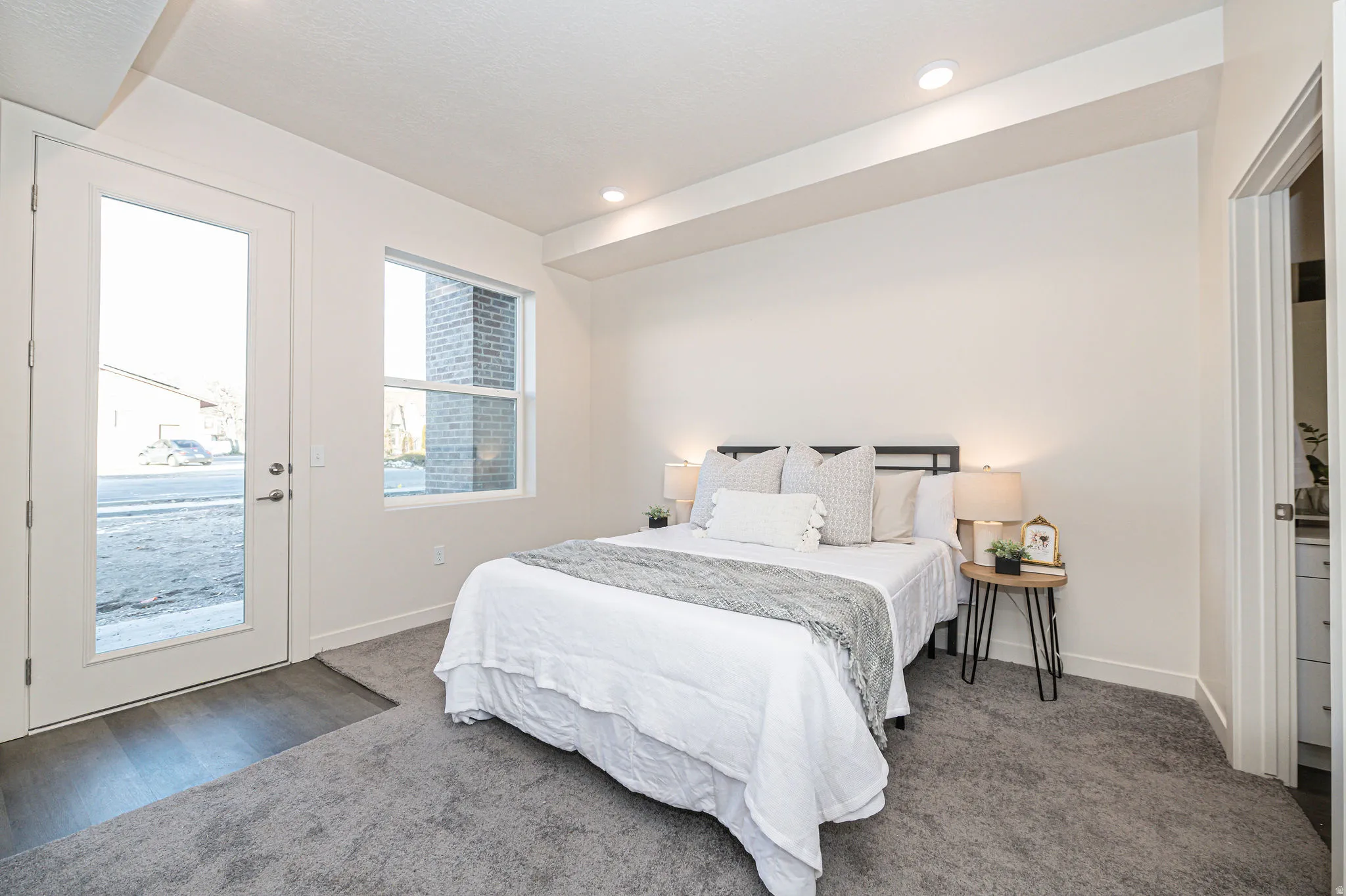 Carpeted bedroom featuring access to exterior and recessed lighting