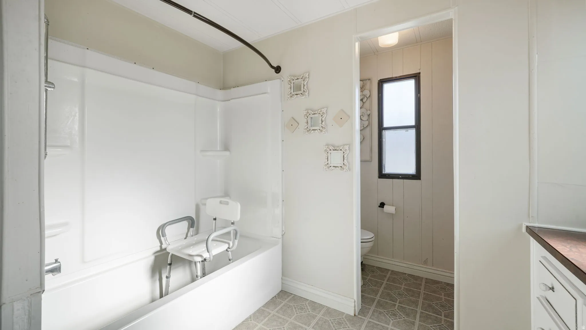 Full bathroom featuring bathing tub / shower combination, vanity, and light tile patterned floors