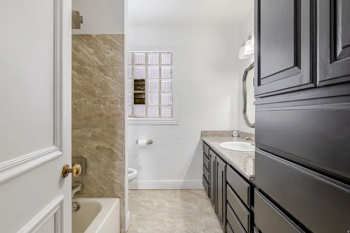Bathroom featuring vanity and shower / bath combination