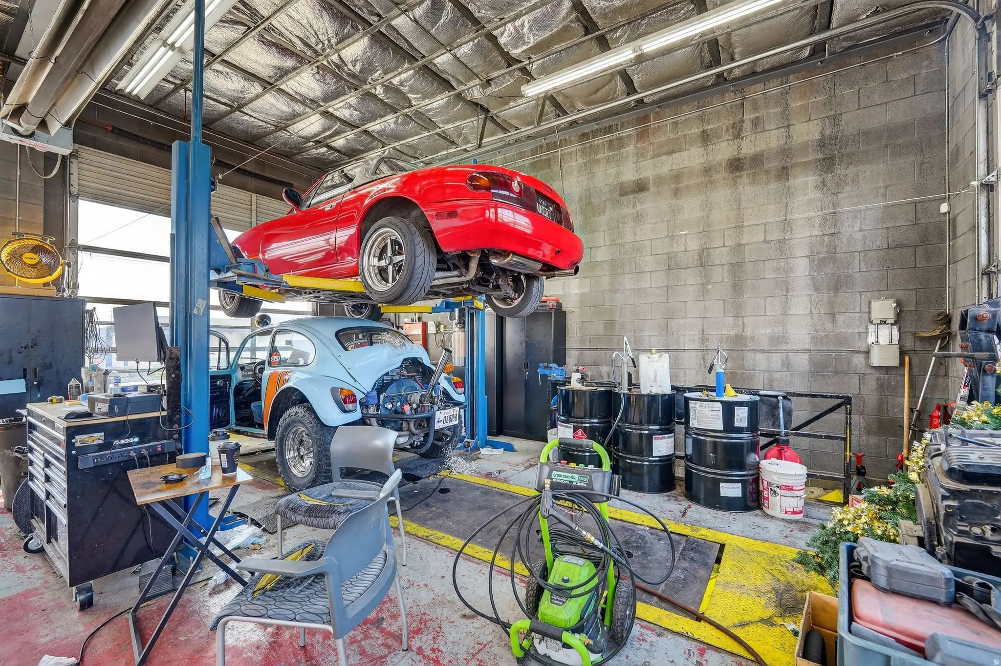 Garage featuring concrete block wall