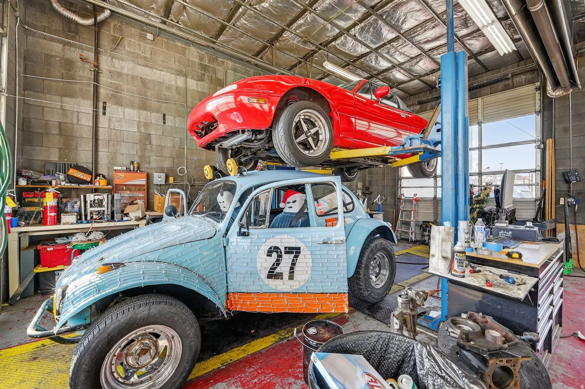Garage featuring concrete block wall