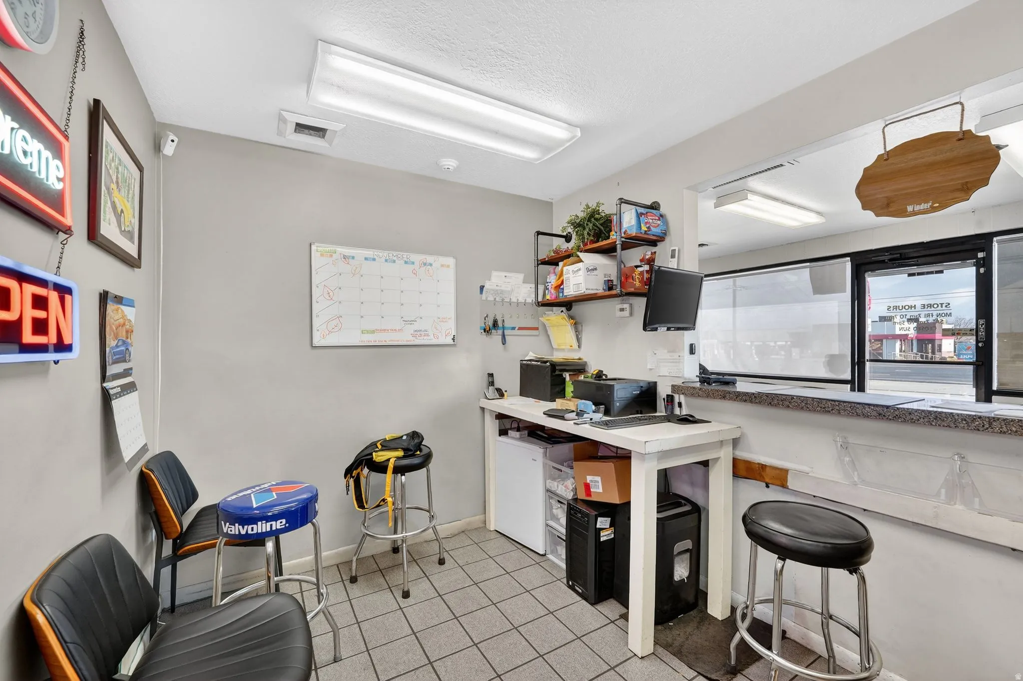 Kitchen with open shelves and a textured ceiling