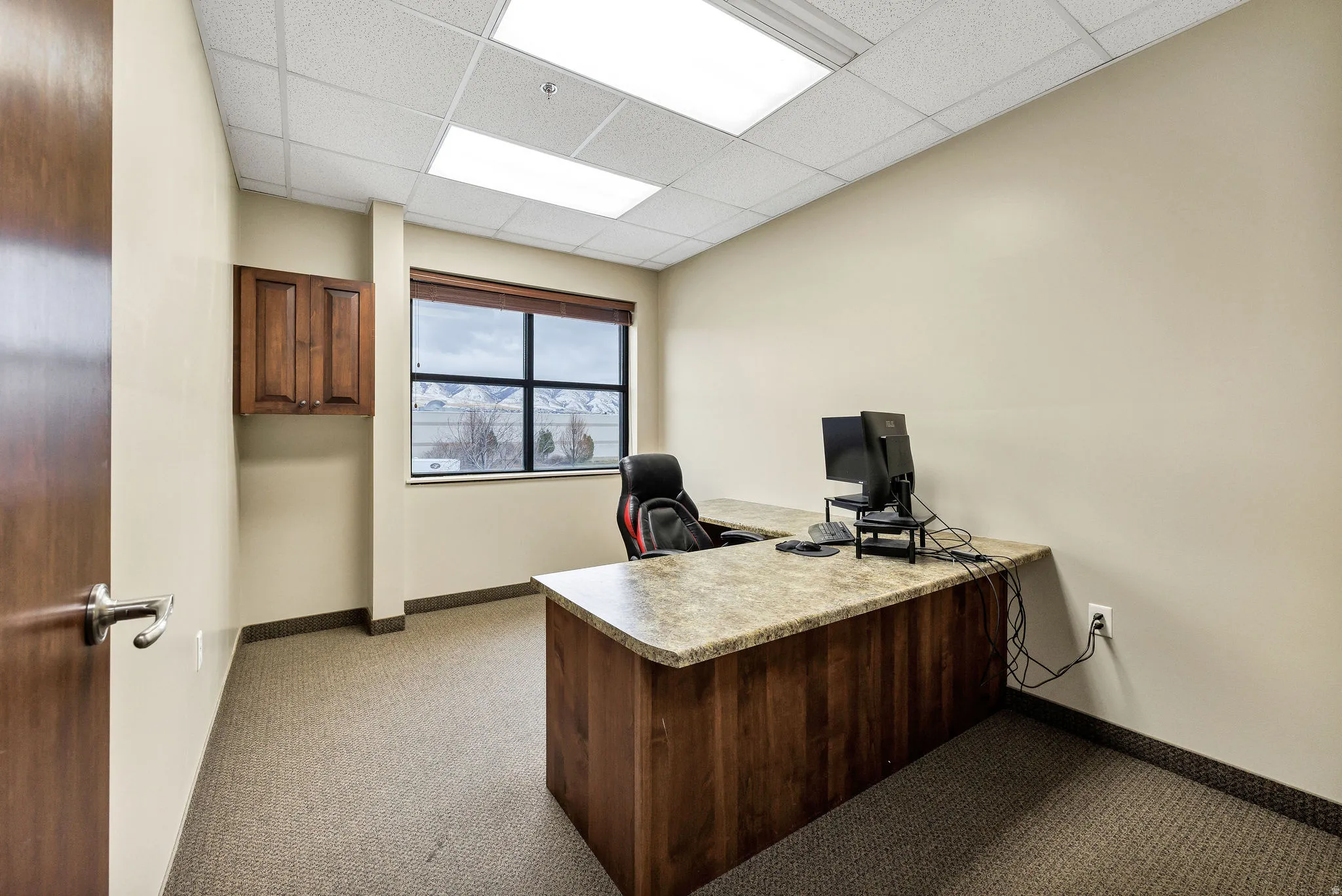 Office featuring a paneled ceiling