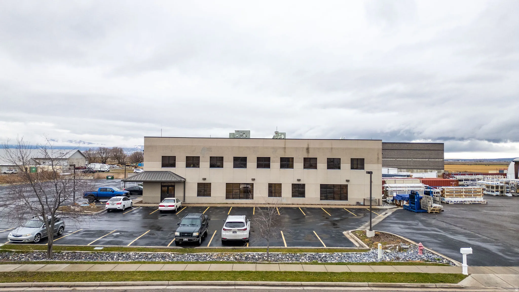 View of commercial location with uncovered parking