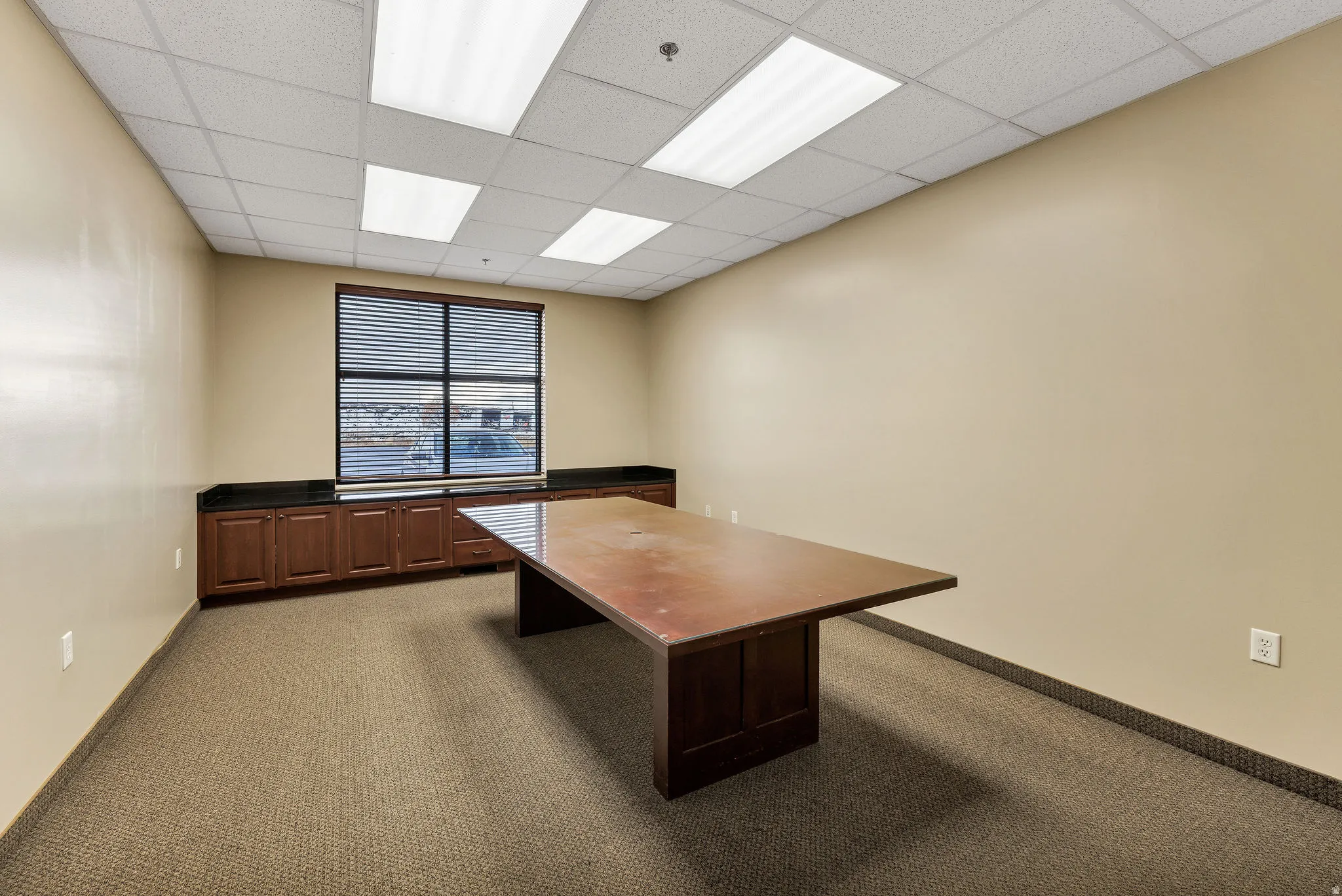 Unfurnished office with a drop ceiling