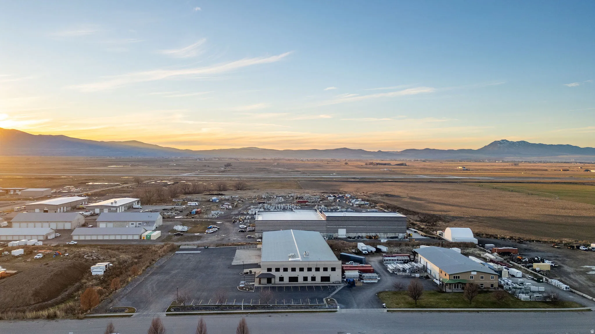 Aerial view of an industrial area and a mountainous background