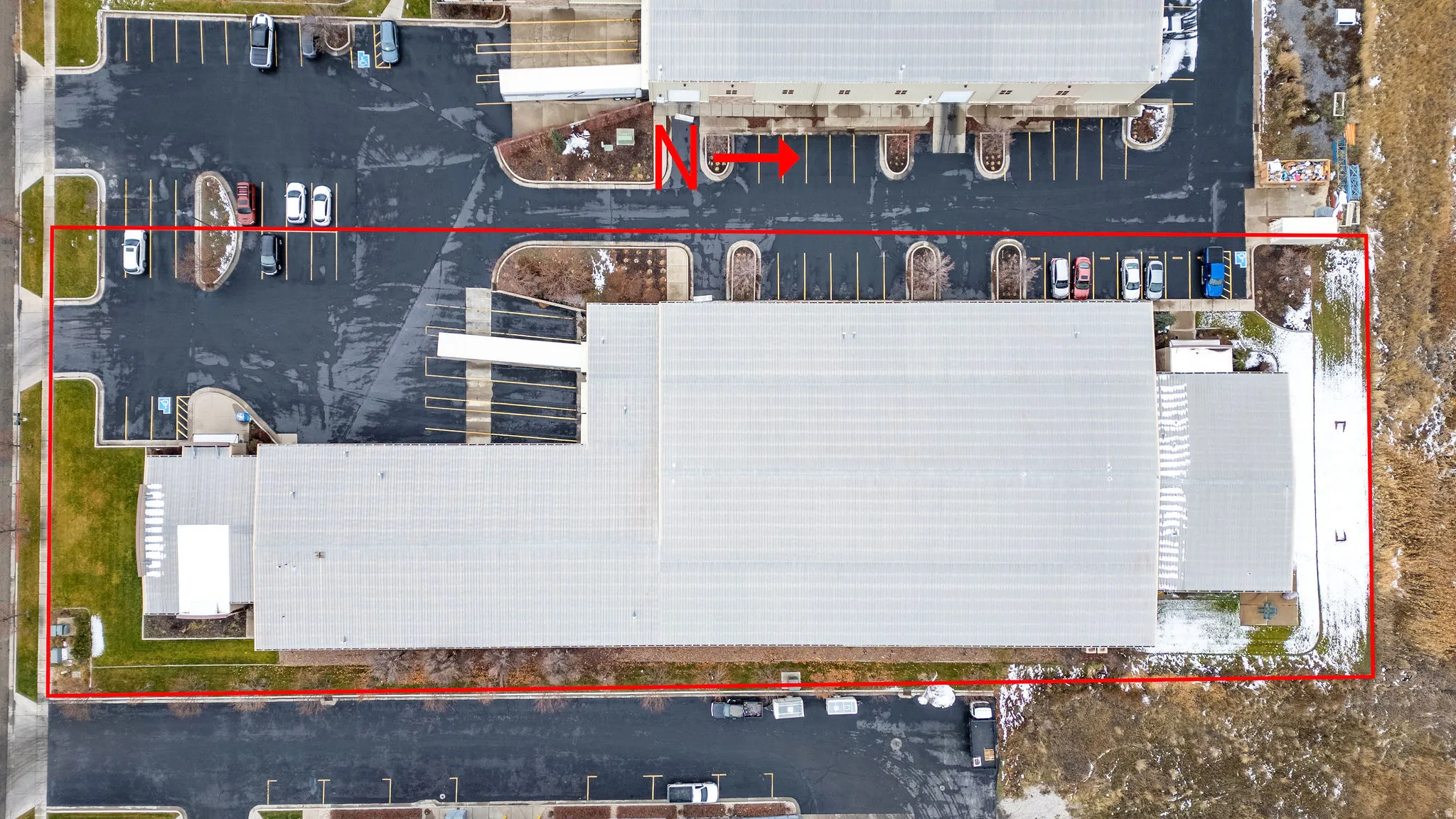 Aerial view of property and surrounding area with property parcel outlined