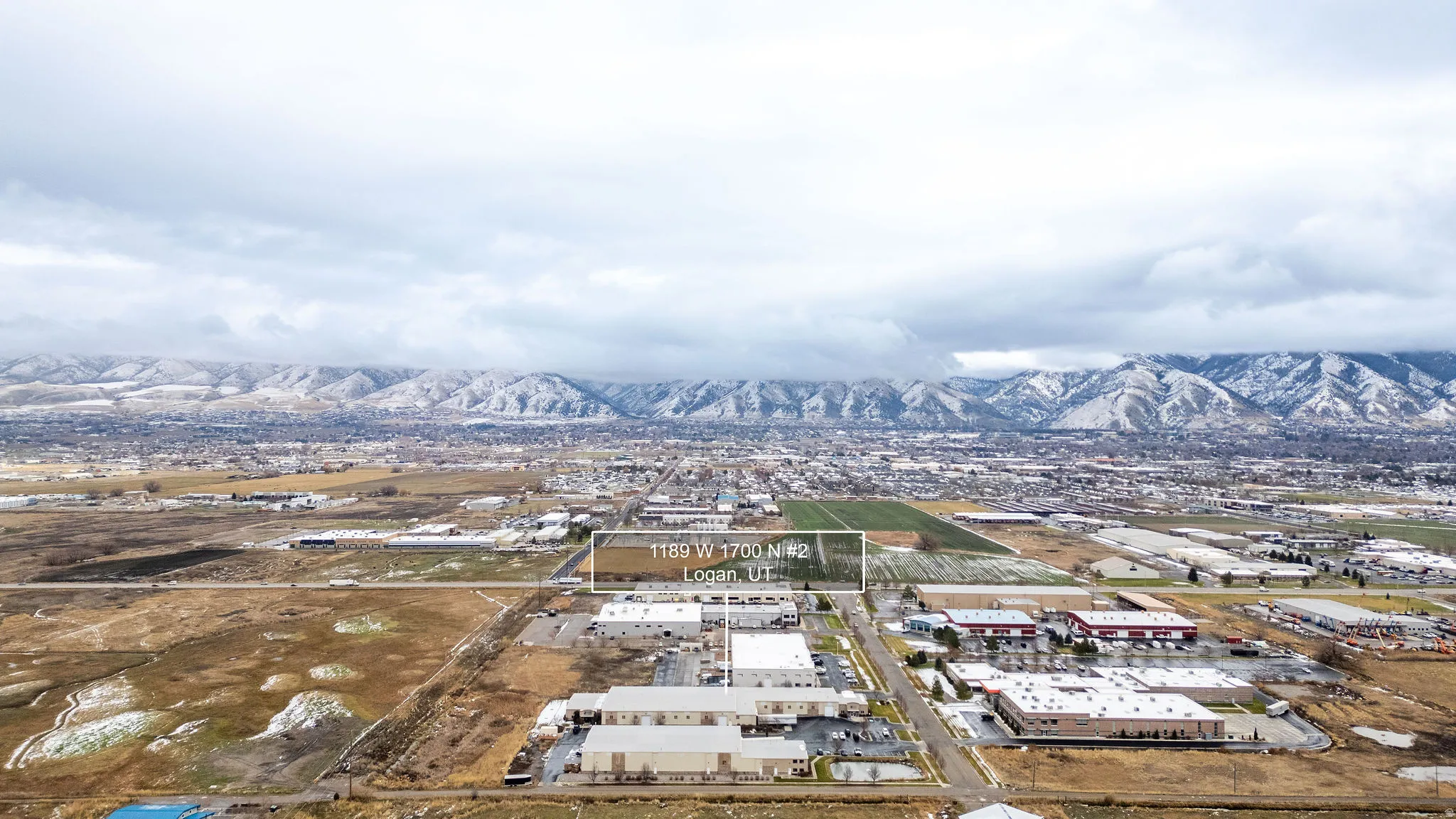 Drone / aerial view of industrial structures and mountains