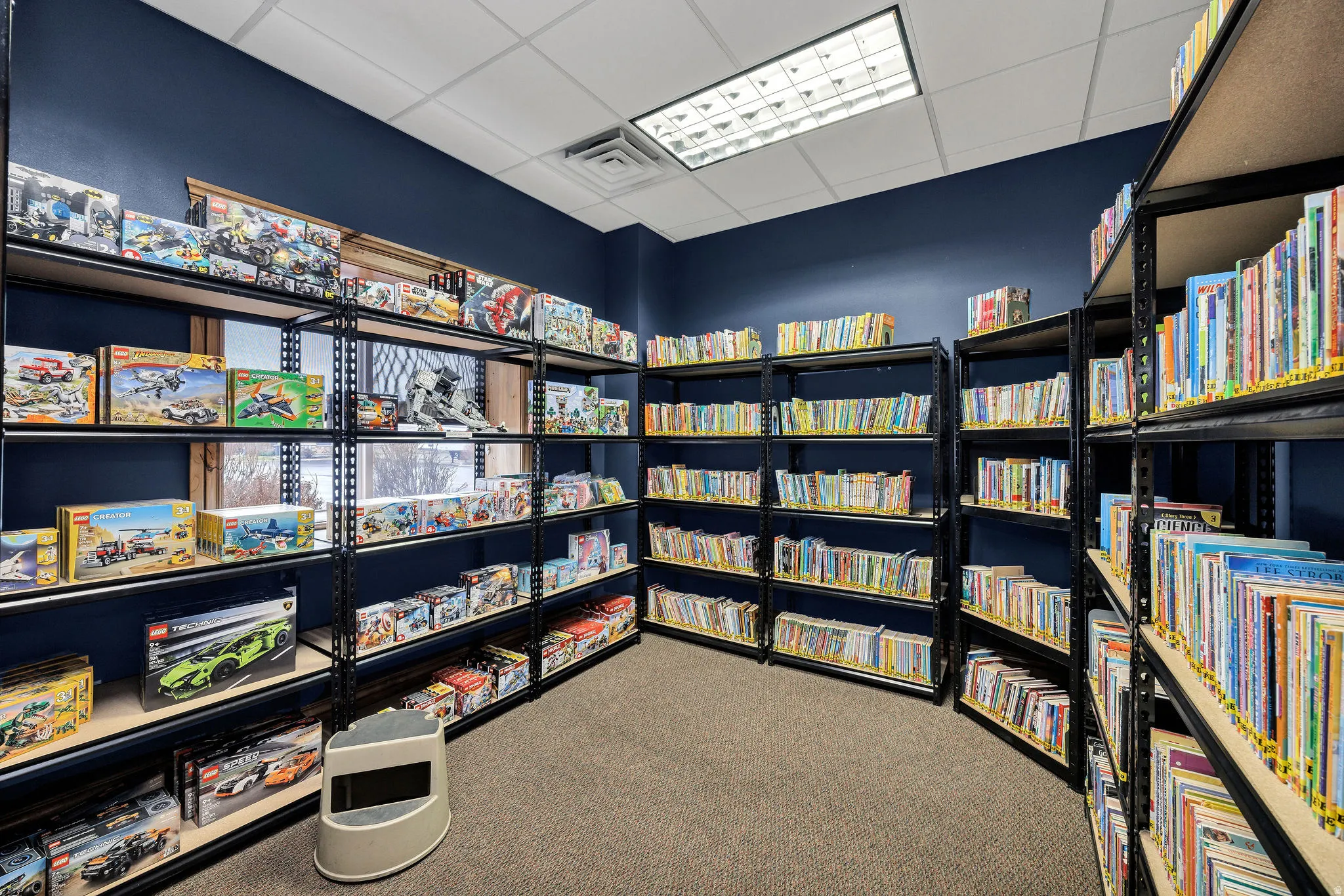 Miscellaneous room with a paneled ceiling