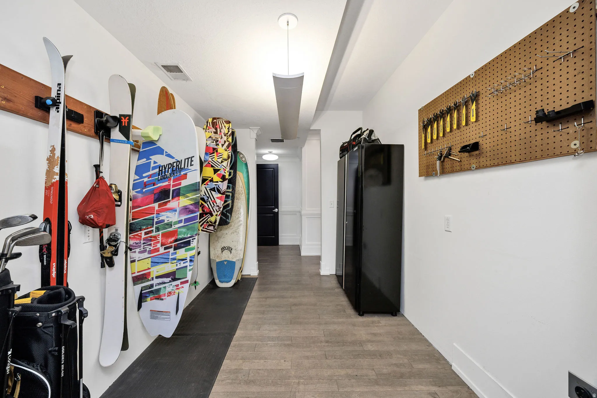 Corridor featuring light wood finished floors