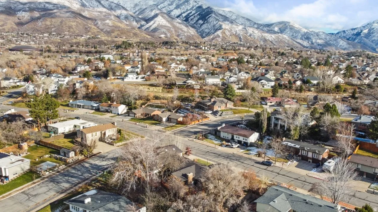 Aerial perspective of suburban area featuring a mountainous background