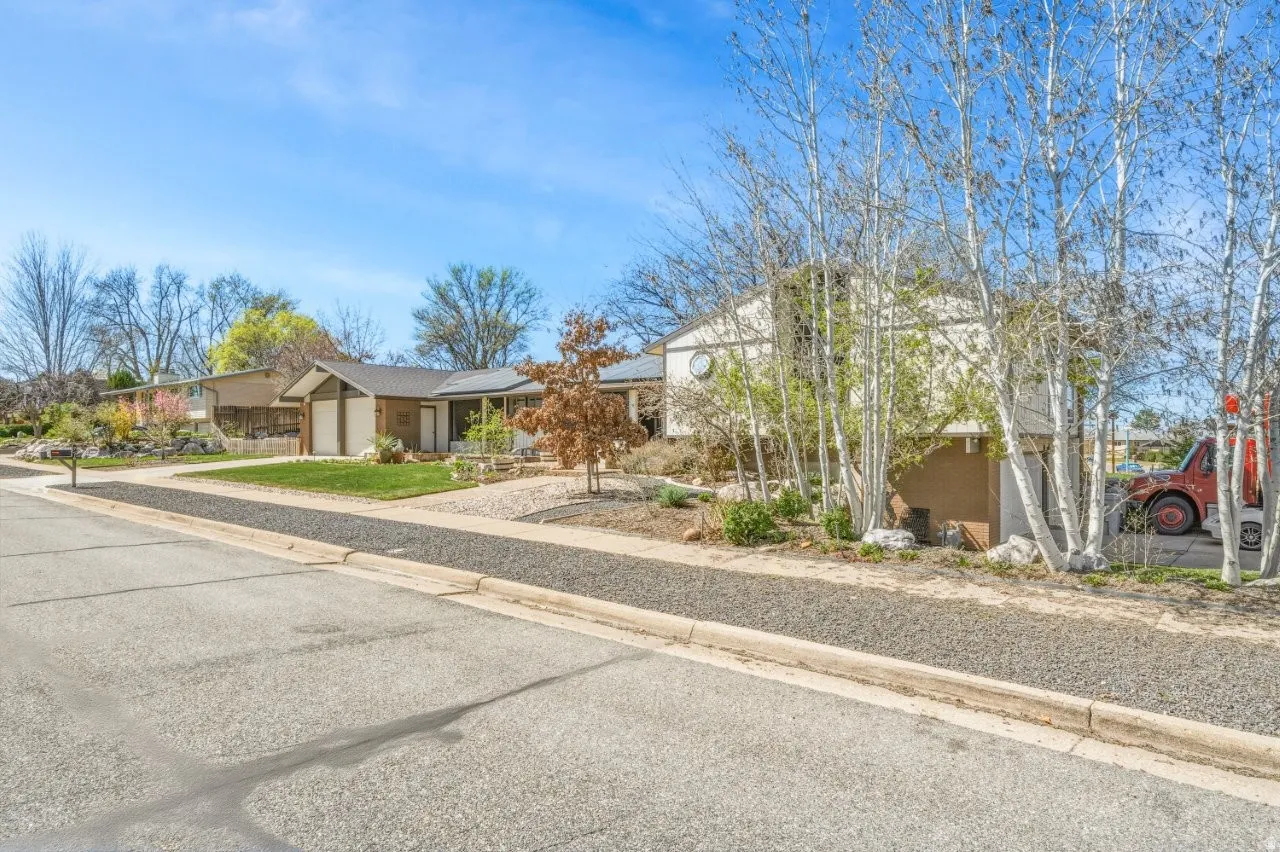 Ranch-style home featuring an attached garage and driveway