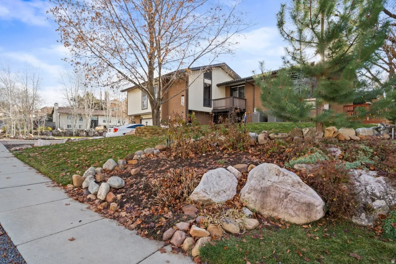 View of front of house with a residential view and a balcony