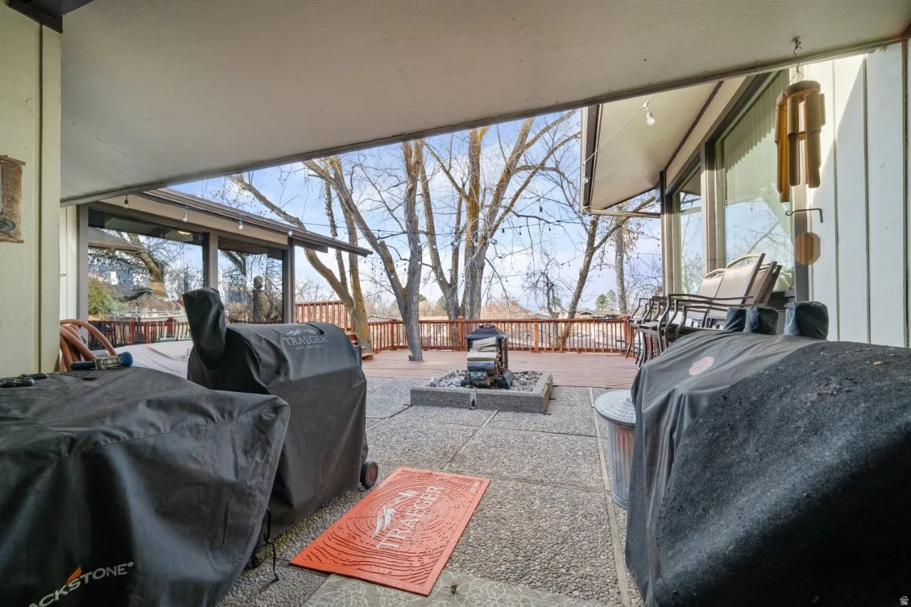 View of patio / terrace featuring a fire pit and a grill