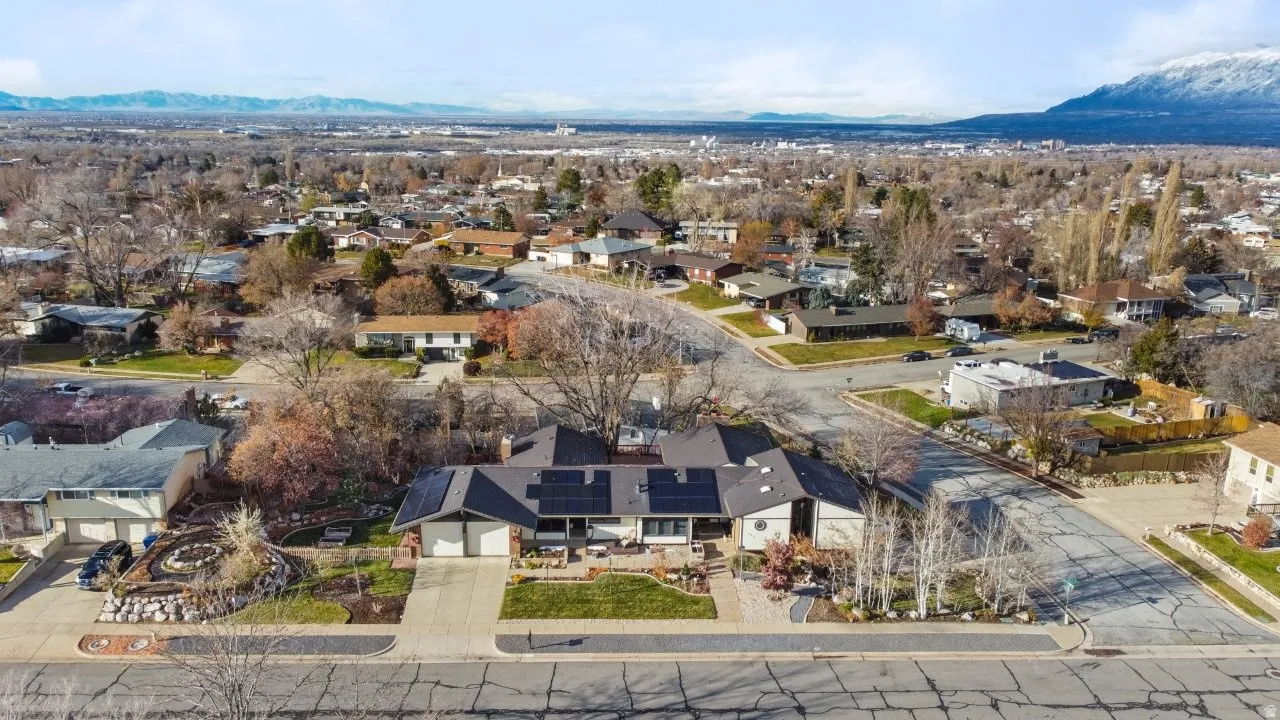 Aerial perspective of suburban area featuring a mountainous background
