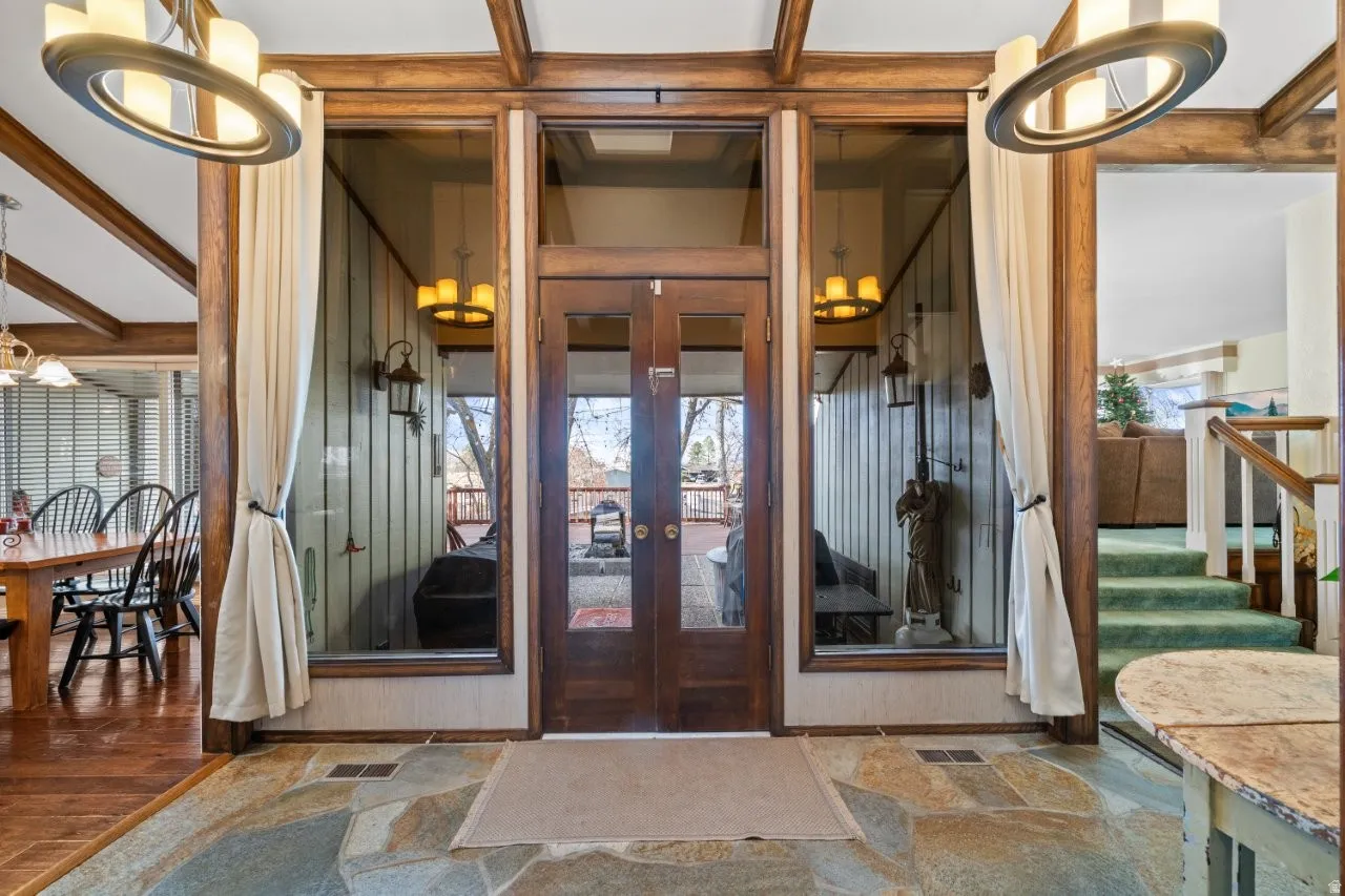View of exterior entry featuring french doors