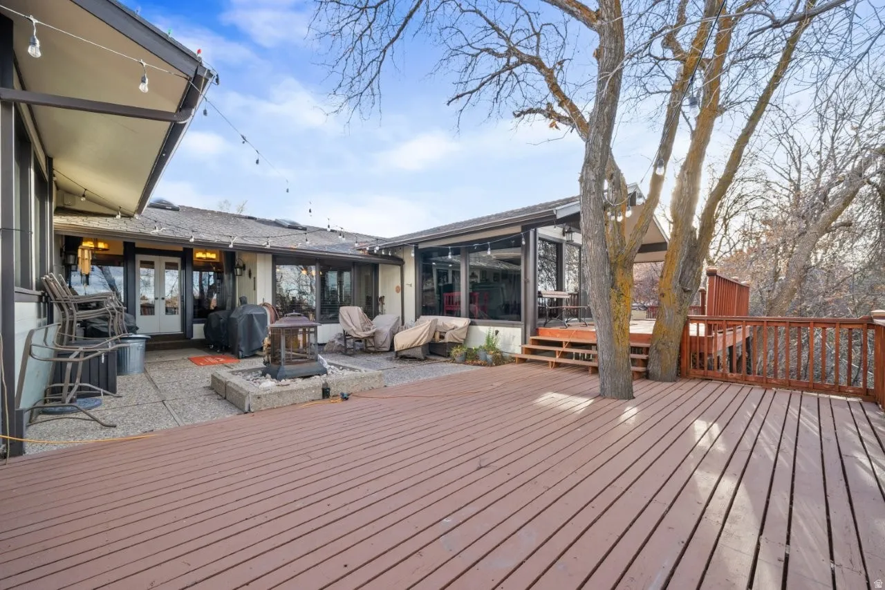 Deck featuring french doors, a patio area, and a grill