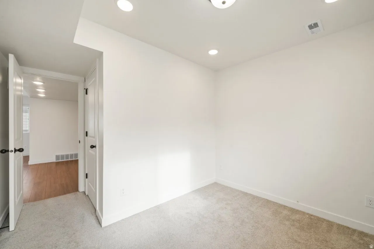 Spare room with carpet and recessed lighting