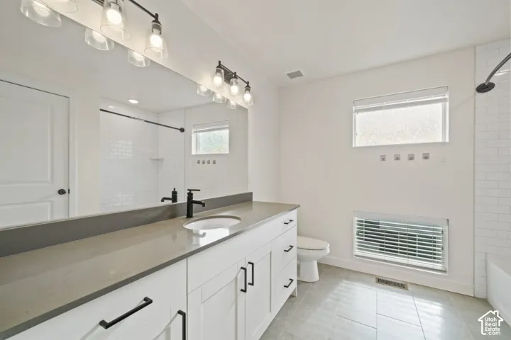 Full bathroom featuring vanity, bathing tub / shower combination, and light tile patterned floors