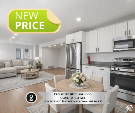 Modern kitchen featuring white cabinetry, stainless steel appliances, and dark countertops
