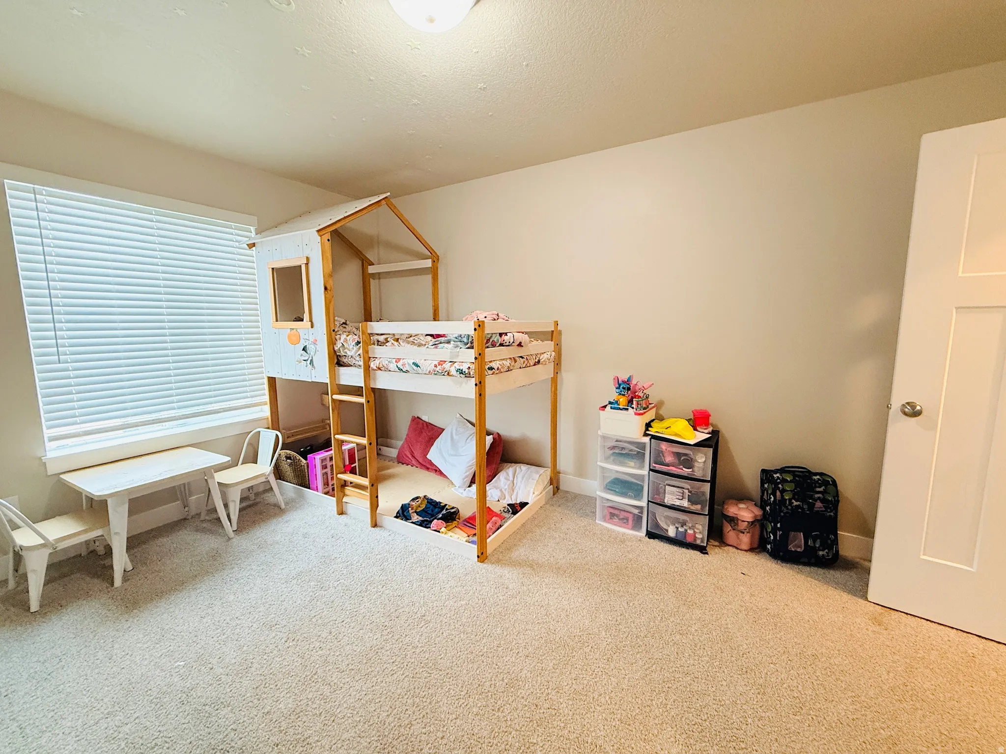 Bedroom with carpet and baseboards