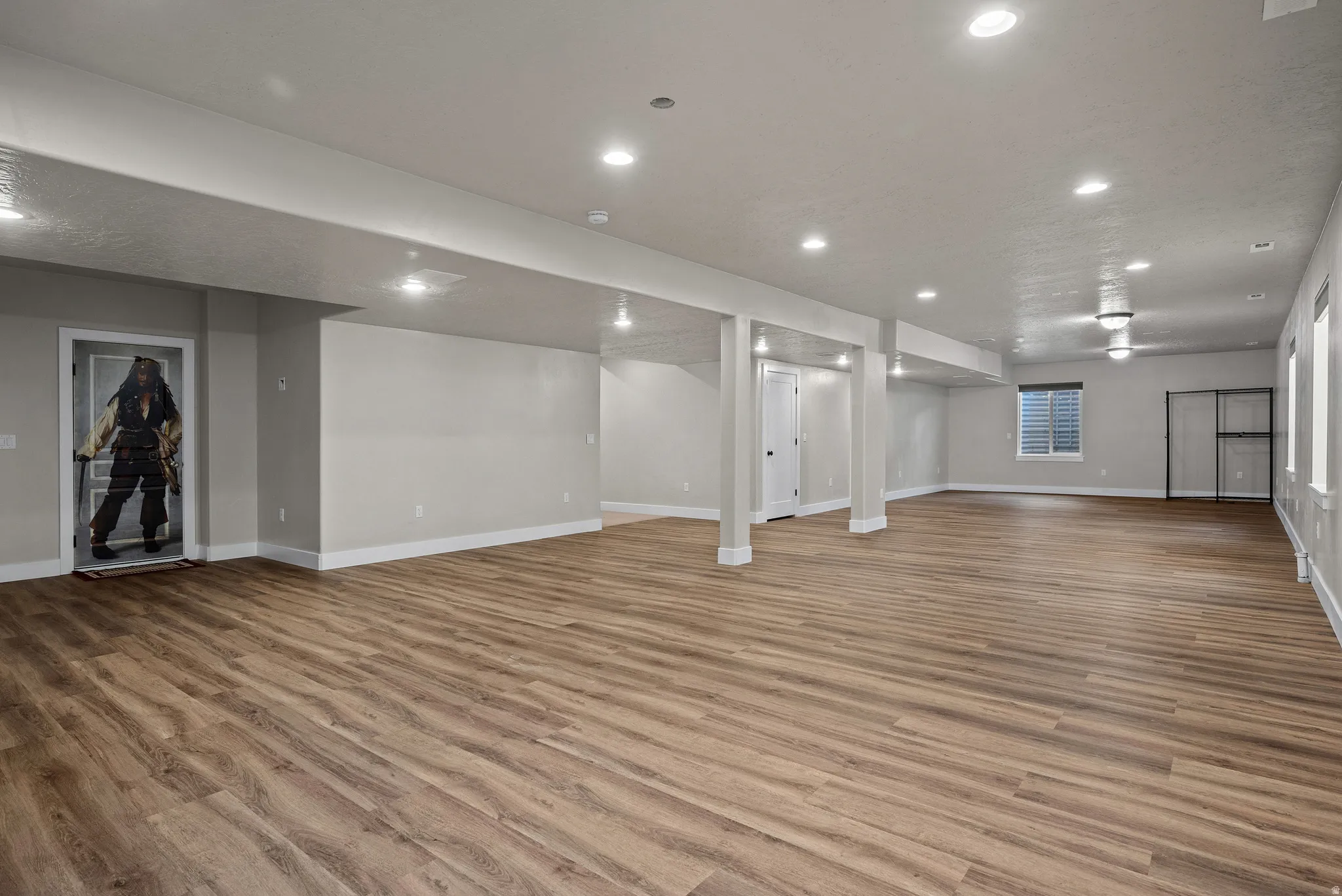 Finished basement featuring recessed lighting and light wood-type flooring