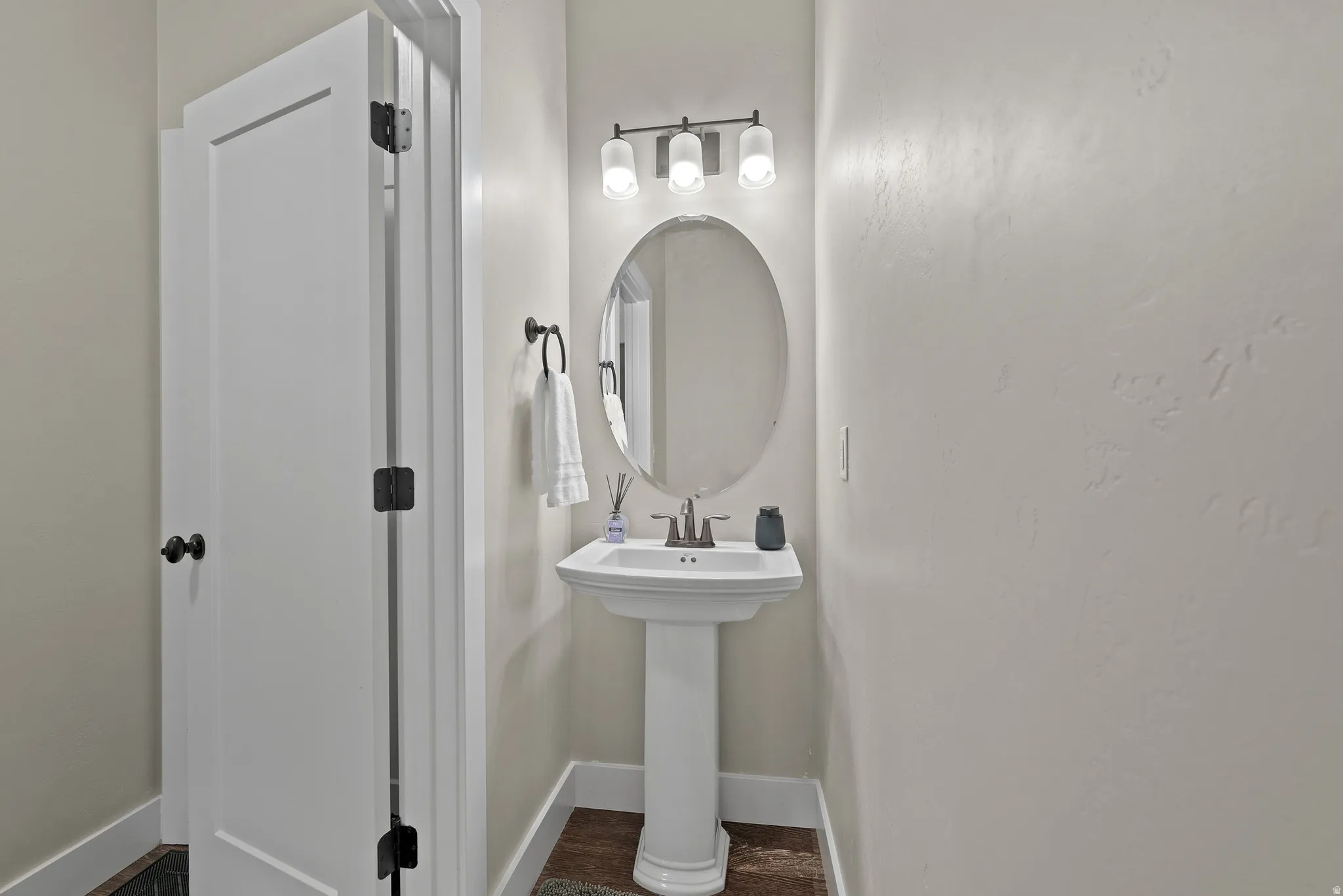Half bathroom with baseboards