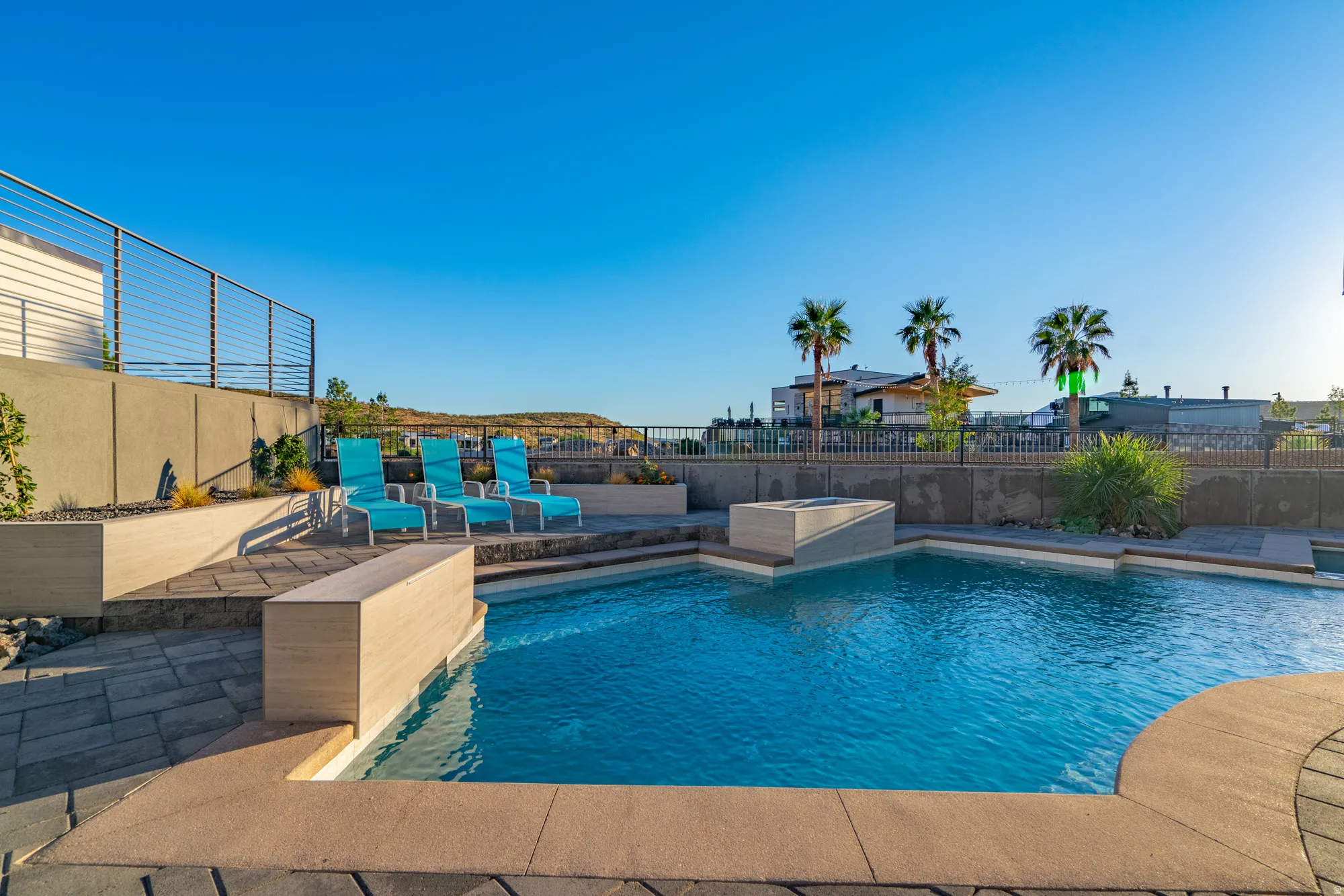 View of pool with a fenced backyard and a patio
