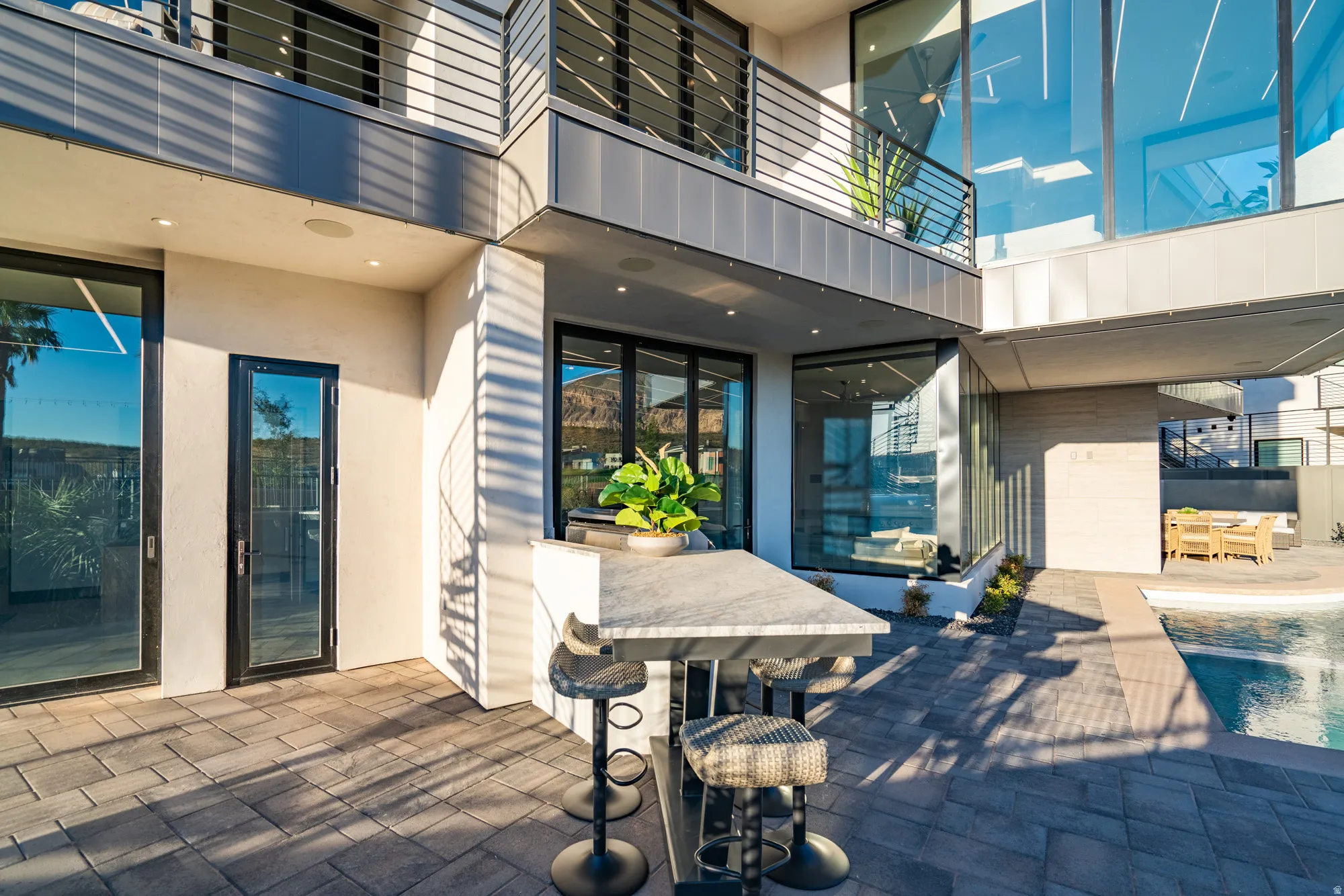 Patio / terrace with outdoor dining area, a patio area, and an outdoor pool