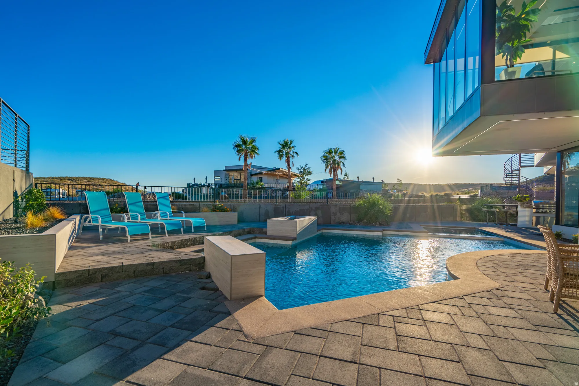 View of pool with a patio area, grilling area, and a fenced backyard