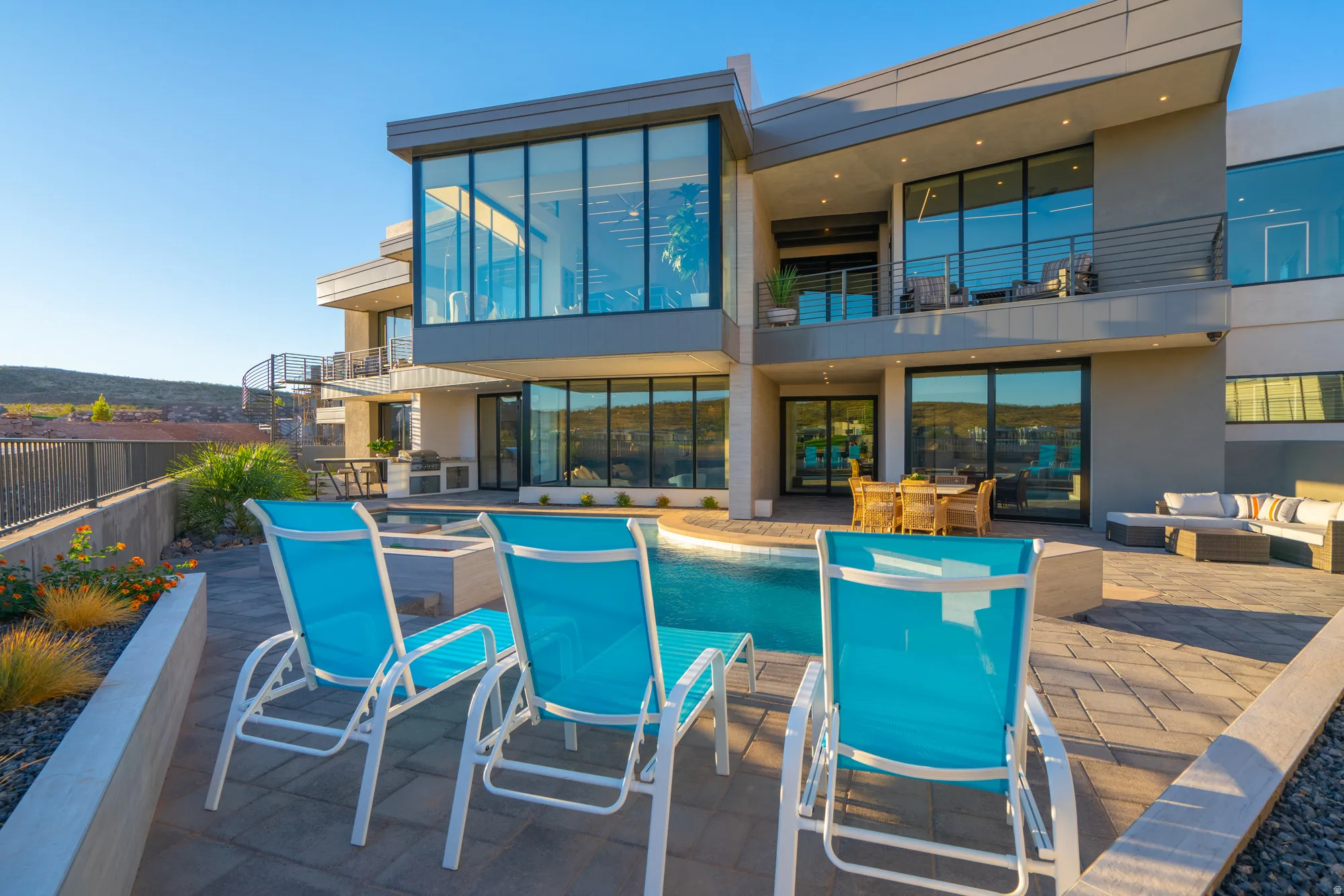 Back of house featuring a patio area, a balcony, outdoor dining space, stucco siding, and an outdoor living space