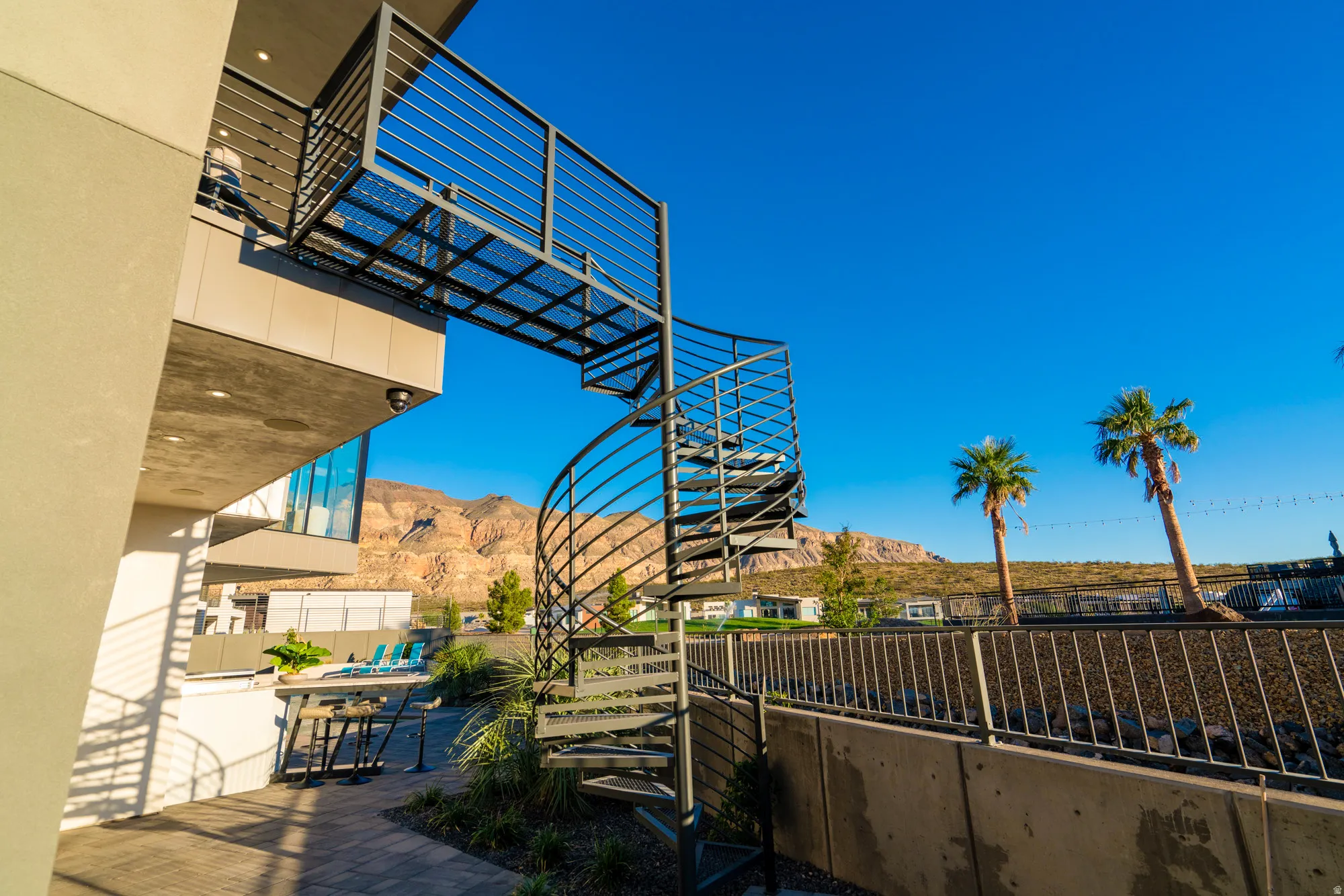 View of home's community featuring a mountain view and a patio area