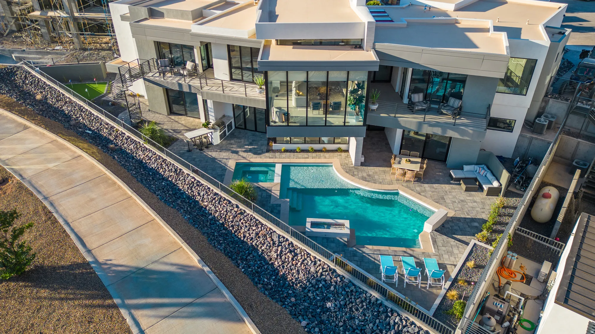 View of pool featuring outdoor lounge area, a balcony, a patio, and a fenced backyard