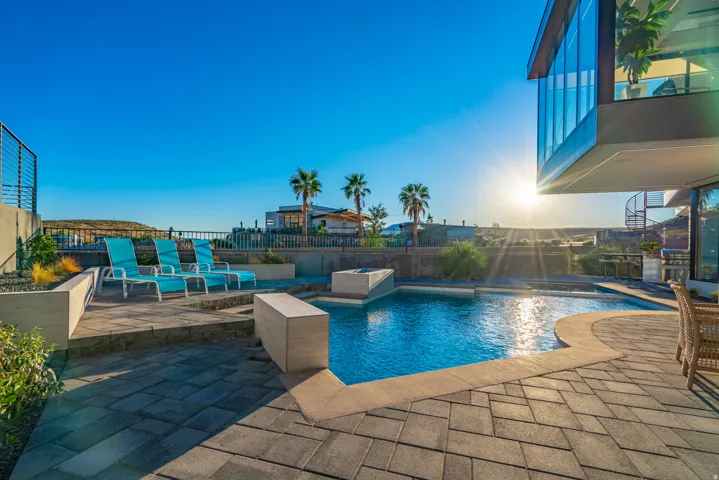 View of pool with a patio area, grilling area, and a fenced backyard