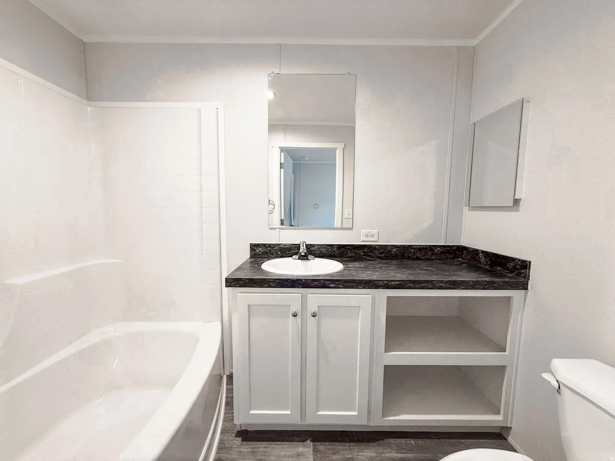 Full bath featuring vanity and shower / bathtub combination