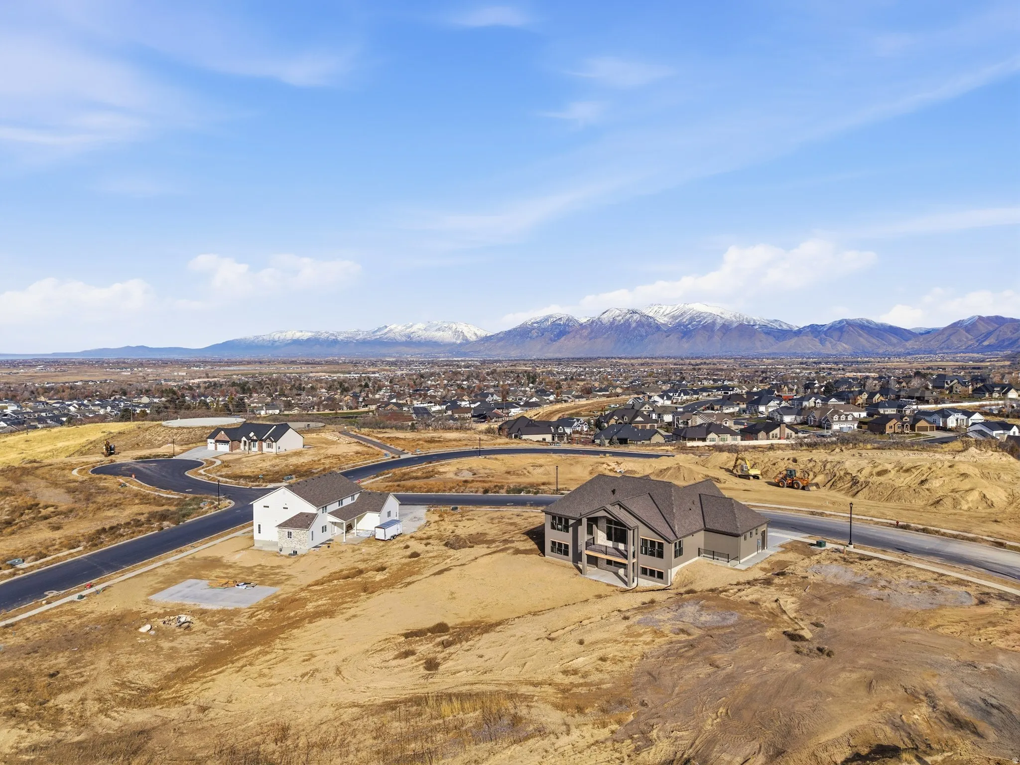 Aerial perspective of suburban area featuring a mountainous background