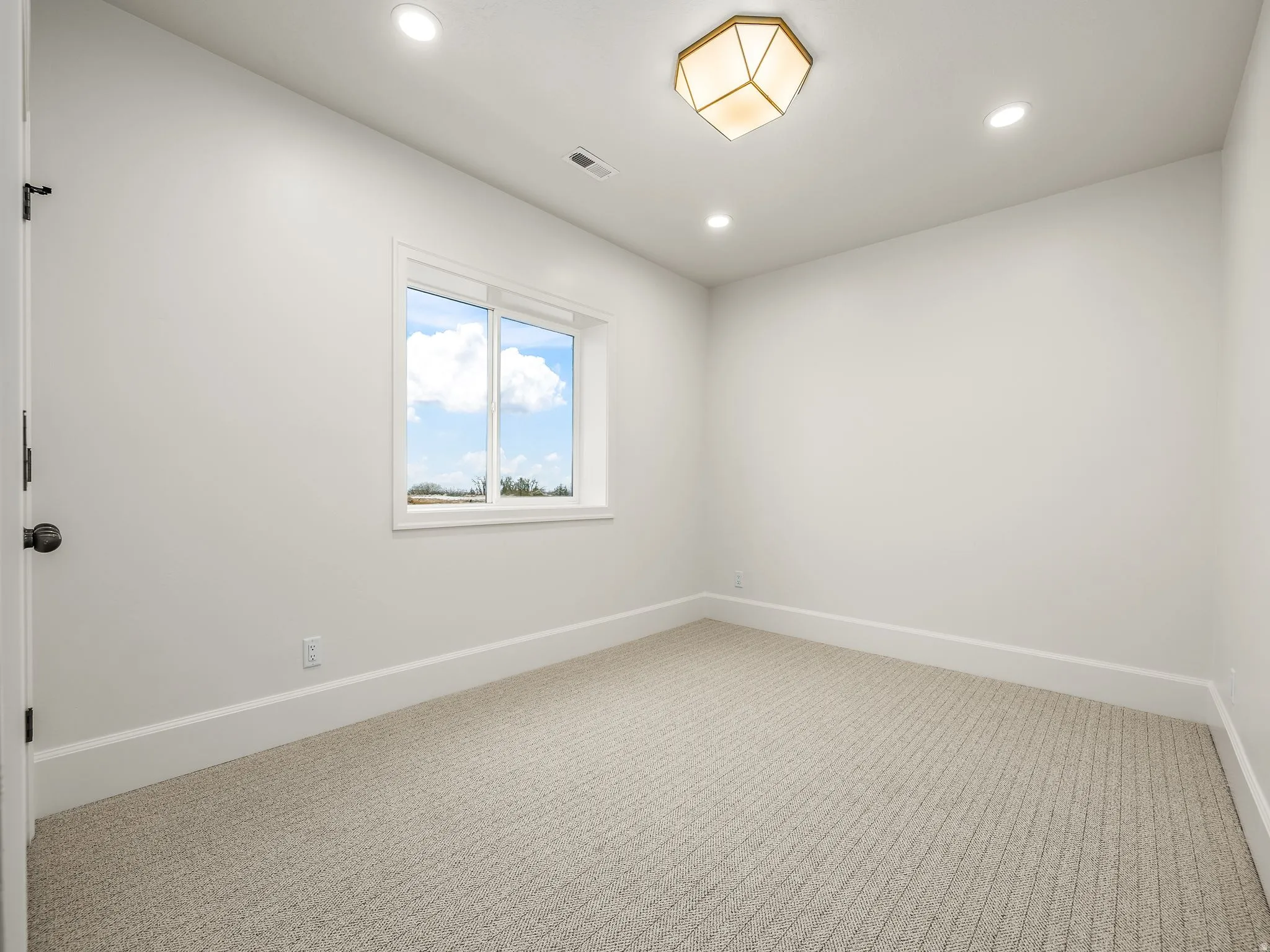 Unfurnished room featuring carpet floors and recessed lighting