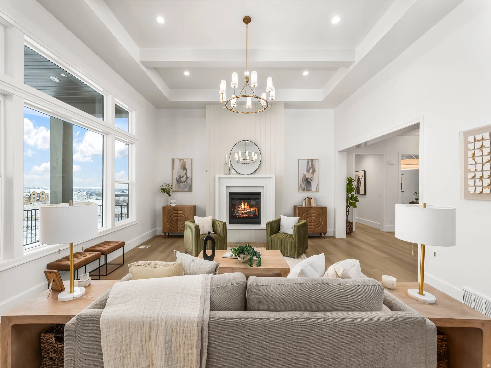 Living room featuring a fireplace, a chandelier, wood finished floors, recessed lighting, and beamed ceiling