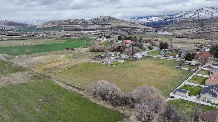Aerial overview of property's location with mountains and rural landscape