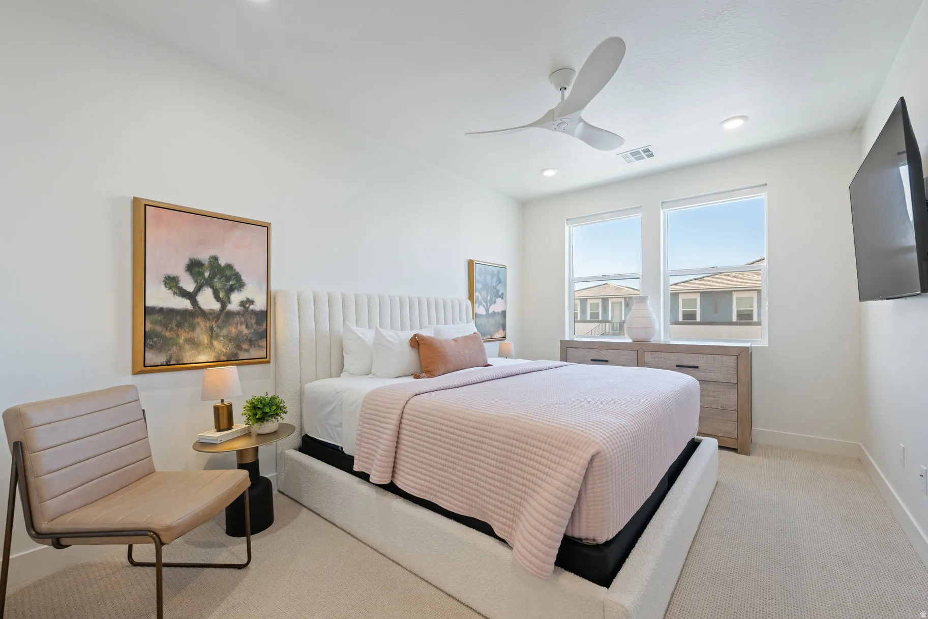 Bedroom with light carpet, ceiling fan, and recessed lighting