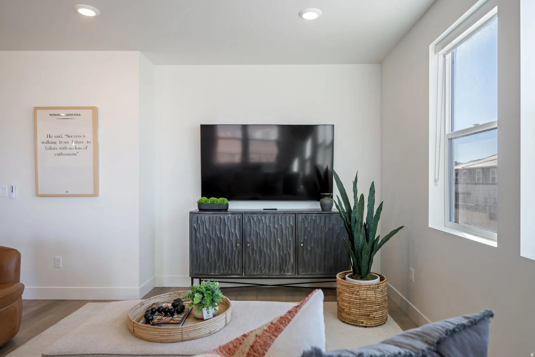 Living room featuring wood finished floors and recessed lighting