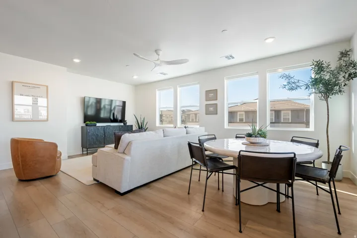 Dining space with a ceiling fan, light wood finished floors, and recessed lighting