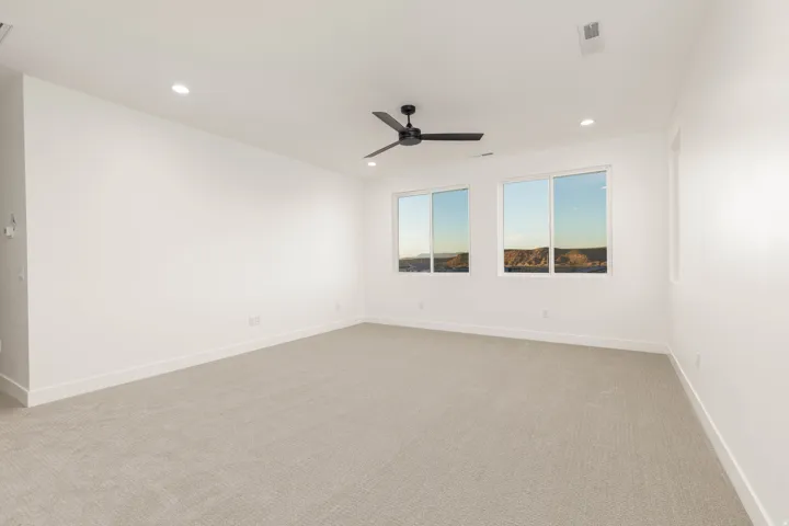 Unfurnished room featuring light colored carpet, recessed lighting, and ceiling fan
