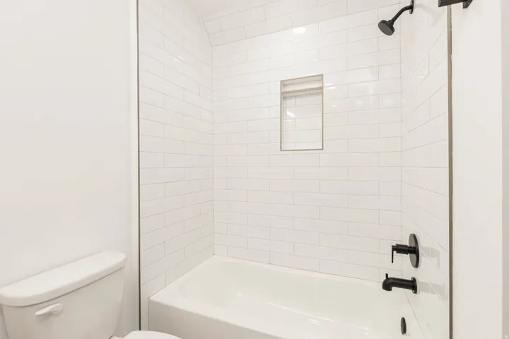 Full bath with tub / shower combination and toilet